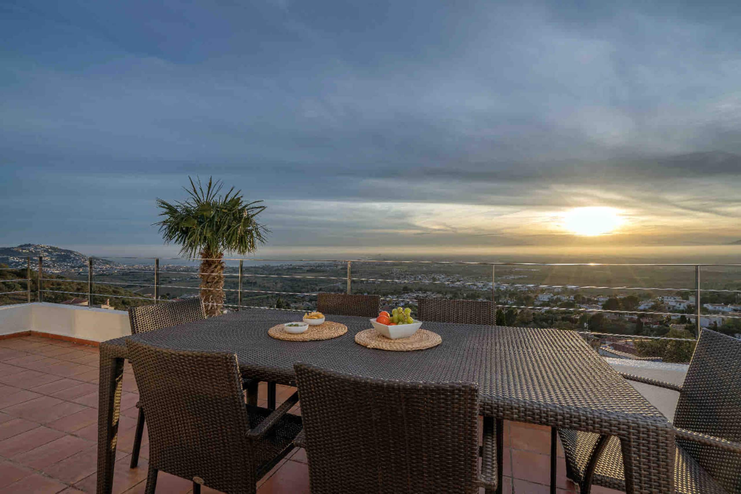 Sunset over the outdoor dining table on the terrace