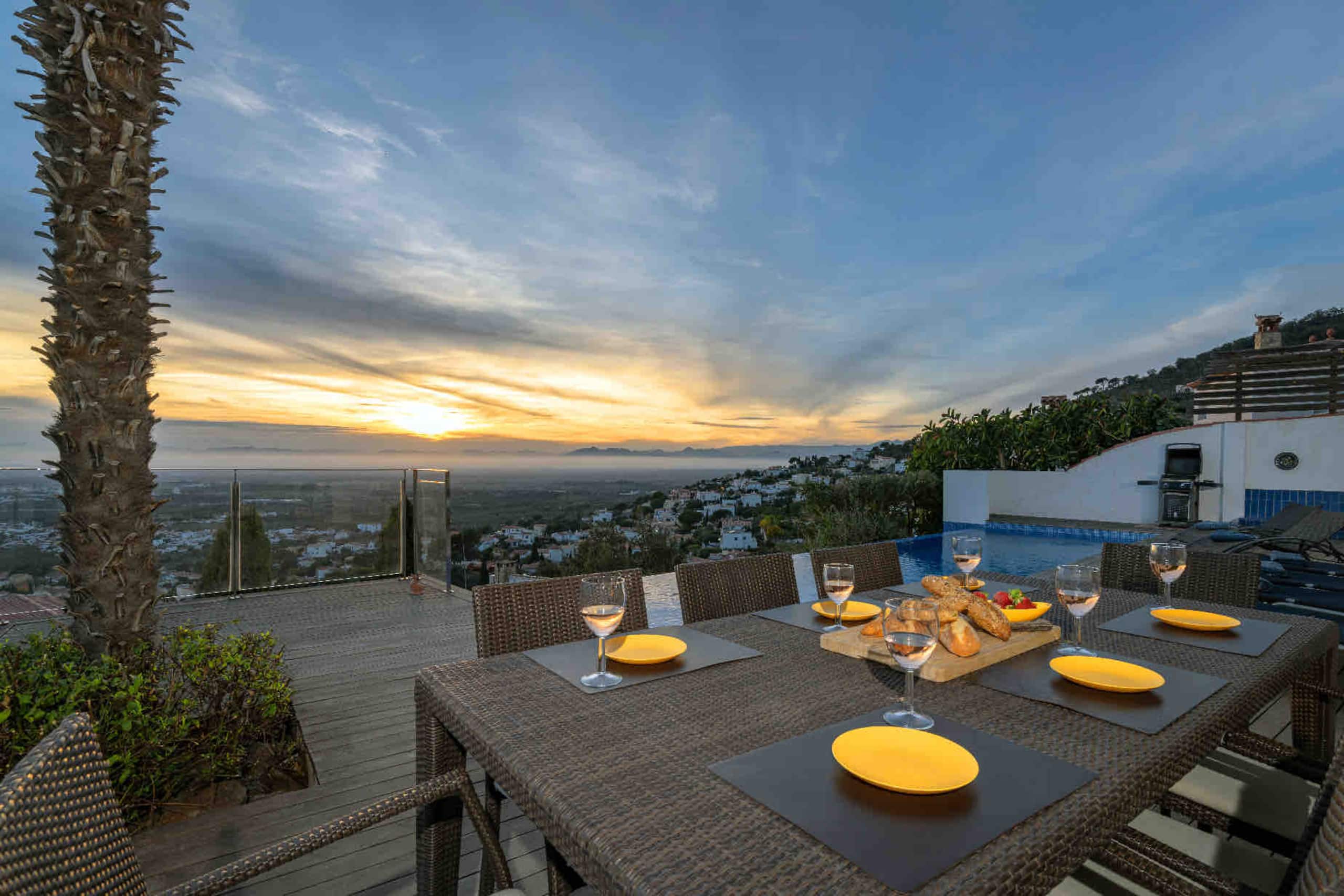 Outdoor dining set for sunset with the bay below
