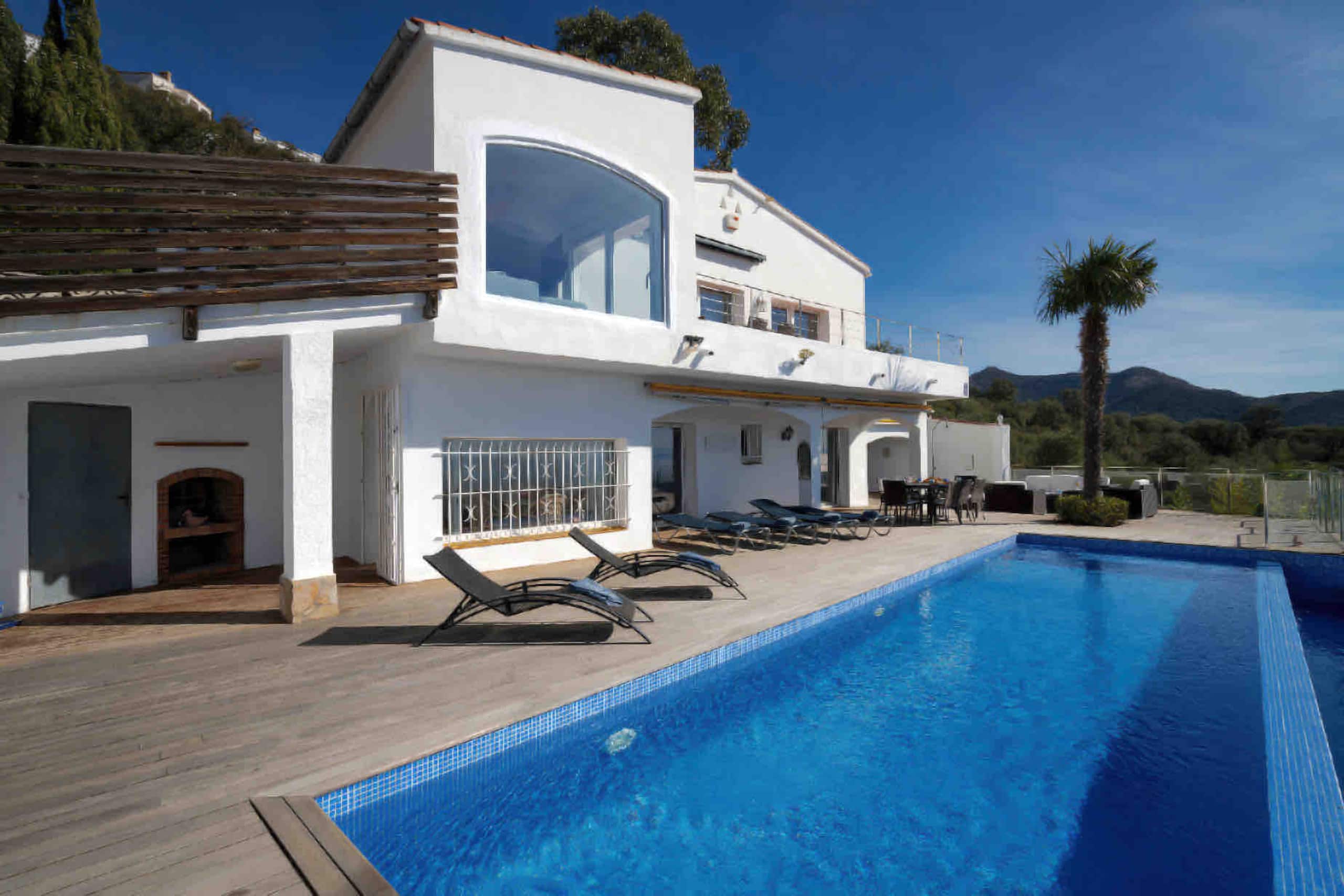 Pool deck and arched terrace in afternoon light